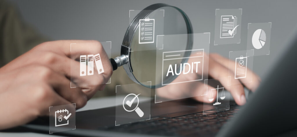 Businessman using computer to audit and evaluate corporate financial statements