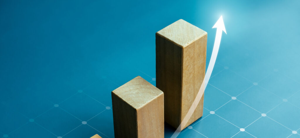 rise up arrow on wooden cube blocks