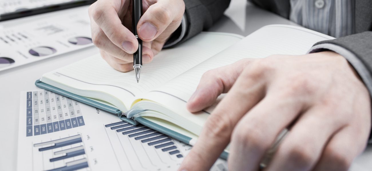 Businessman,Analyzing,Investment,Charts.,Accounting